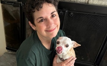 Kathleen Summers, outreach and research director for the Stop Puppy Mills campaign at Humane World for Animals, holding Peanut the dog.